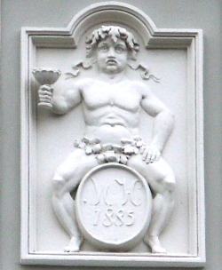 Bacchus - wine god - called 'Fat Maryna', is associated with Torun wine and raftsmen tradition. Fragment of the fasade of 5 Old City Market Square historical house
